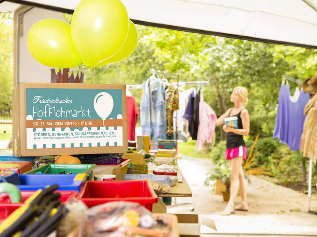 Consumerism: Adult women buying at a yard sale in suburbs.